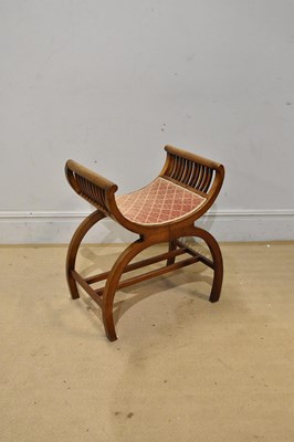 Lot 2415 - An Edwardian mahogany X frame stool, height 70cm.
