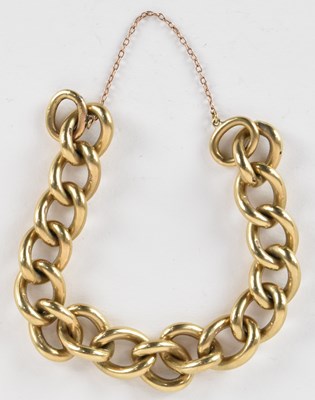 Lot 1356 - A 9ct gold heavy large curb link bracelet,...