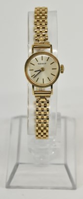 Lot 1653 - TISSOT; a lady's 9ct gold wristwatch, the...