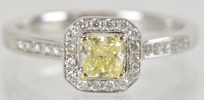 Lot 1365 - An 18ct white gold yellow diamond set ring,...