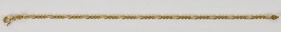 Lot 1427 - An 18ct gold figaro link bracelet, with ring...