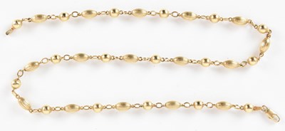 Lot 1382 - A 9ct gold coffee bean necklace, with lobster...