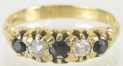 Lot 1521 - A 9ct gold ring set with three sapphires and...