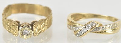 Lot 1467 - A 9ct gold white stone crossover ring, size N,...