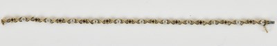 Lot 1407 - A 9ct gold line bracelet, with eleven tiny...