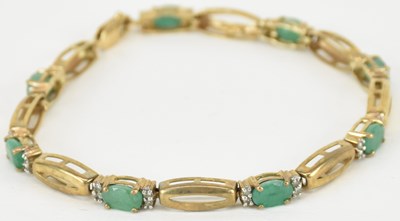 Lot 1408 - A 9ct gold line bracelet, with eight emerald...