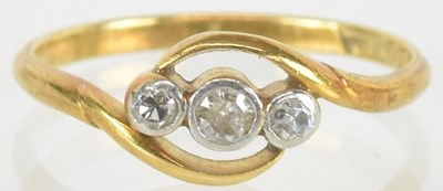 Lot 1529 - An 18ct gold ring with three small bezel set...