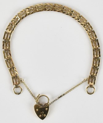 Lot 1406 - A 9ct gold three bar gate bracelet, with 9ct...