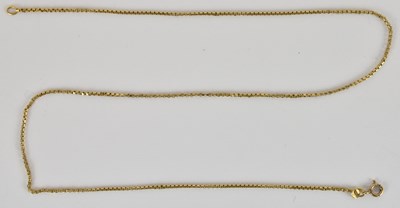 Lot 1391 - An 18ct gold necklace with 9ct gold ring clasp,...