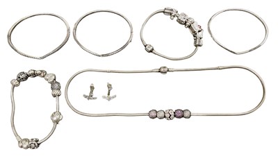 Lot 1409 - PANDORA; two charm bracelets with various...
