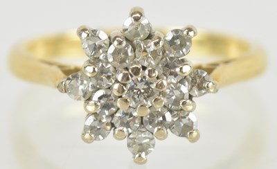 Lot 1431 - An 18ct gold diamond floral cluster ring, size...