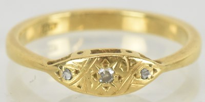 Lot 1432 - An 18ct gold ring, set with three graduated...
