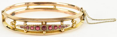 Lot 1362 - A 9ct yellow gold diamond and garnet set...
