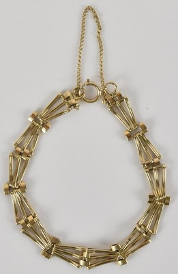 Lot 1419 - A 9ct gold three bar gate bracelet, with ring...