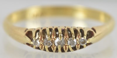 Lot 1450 - An 18ct gold diamond ring, the table set with...