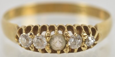 Lot 1566 - A gold diamond ring set with five small...