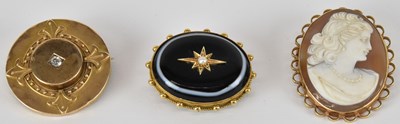 Lot 1492 - Three gold brooches comprising a 15ct gold...