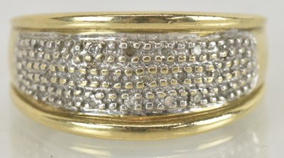 Lot 1495 - A gold ring with multiple lines of diamond...