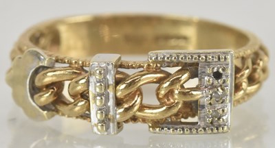 Lot 1447 - A 9ct gold bicolour buckle ring, size T,...