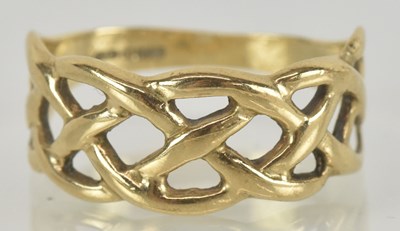 Lot 1497 - A 9ct gold open trellis ring in the Celtic...