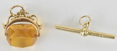 Lot 1508 - A 9ct gold watch chain swivel fob with cut...