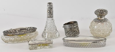 Lot 1305 - Five items of silver topped cut glass dressing...