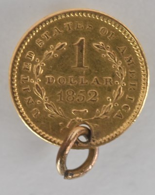 Lot 1624 - An 1852 gold one dollar coin, with pierced...
