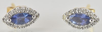 Lot 1511 - A pair of 18ct gold stud earrings, with...
