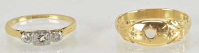 Lot 1454 - Two 18ct gold rings, the largest with missing...