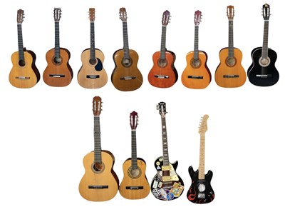Lot 459 - Ten acoustic and two electric guitars,...