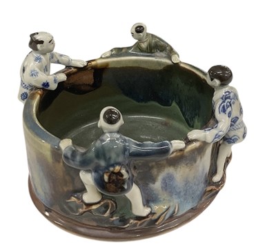 Lot 1208 - A modern Chinese figural pottery dish, with...