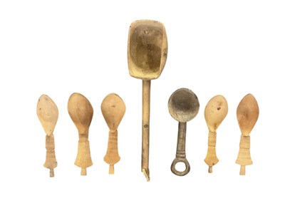 Lot 1089 - A set of five carved wooden spoons, length...