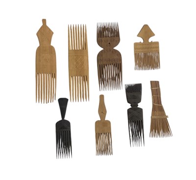 Lot 1090 - Eight African carved wooden combs (8).