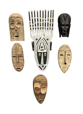 Lot 1026 - Six African carved wooden wall hanging...