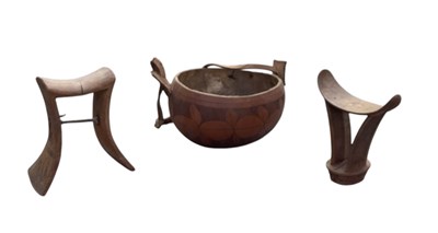 Lot 1085 - An African carved wooden headrest, height...