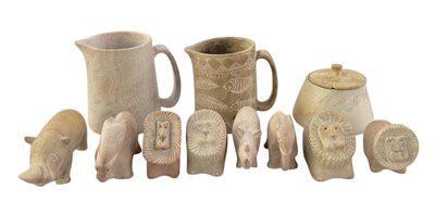 Lot 1086 - Eight African caarvd soap stone figures of...