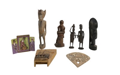 Lot 1091 - Four African carved wooden figures, height of...