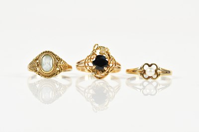 Lot 1444 - Three 9ct yellow gold dress rings, combined...