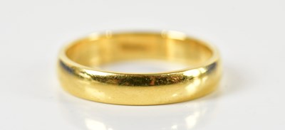 Lot 1441 - An 18ct yellow gold wedding band, size P 1/2,...