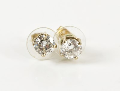 Lot 1667 - A pair of yellow metal diamond ear studs, each...
