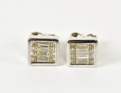 Lot 1669 - A pair of 18ct white gold diamond ear studs,...