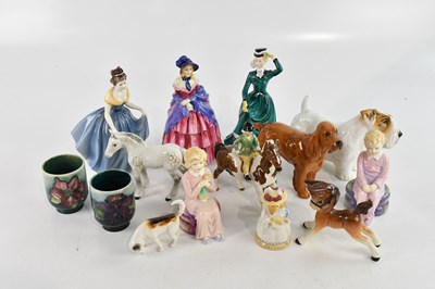 Lot 2730 - A collection of ceramic figures including two...