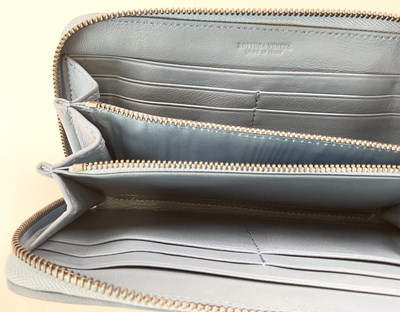 Lot 83 - BOTTEGA VENETA; a pale blue leather clutch bag,...
