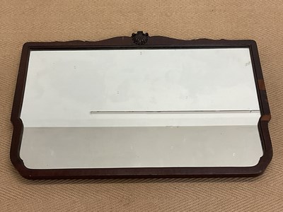 Lot 681 - A 19th century shaped mahogany wall mirror,...