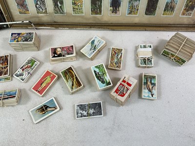 Lot 41 - A group of cigarette and tea cards, loose and...