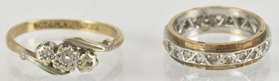 Lot 1447A - A 9ct yellow gold and platinum three stone...