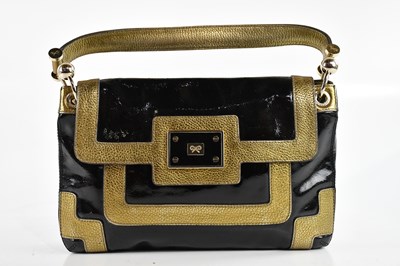 Lot 2038 - ANYA HINDMARCH; a black and patent leather and...