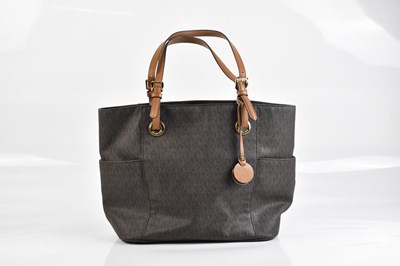 Lot 2039 - MICHAEL KORS; a monogram coated canvas brown...