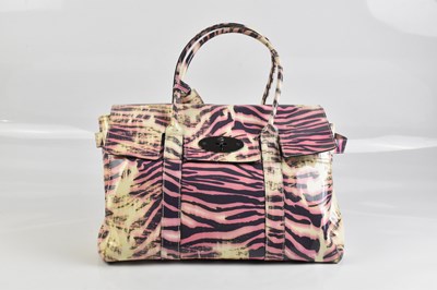 Lot 2019 - MULBERRY; a pink, purple and cream patent...