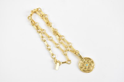 Lot 2086 - RIXO; a gold tone Sol pendant, with turquoise...